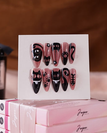 Night Prowler press-on nails in medium stiletto shape — dusty pink black cat hand-painted 3D details nails