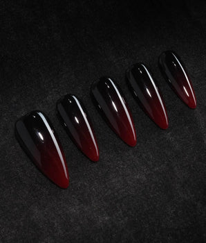 Nightcap press on nails in a near-black wine red that fades to a clearer red at the tip with a high gloss finish - image 1