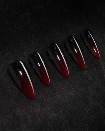 Nightcap press on nails in a near-black wine red that fades to a clearer red at the tip with a high gloss finish - image 1