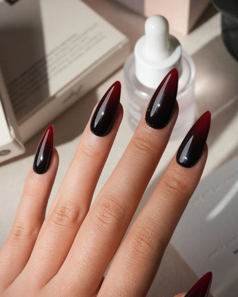 Nightcap press on nails in a near-black wine red that fades to a clearer red at the tip with a high gloss finish - image 2