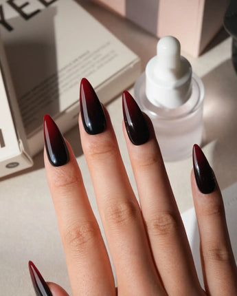 Nightcap press on nails in a near-black wine red that fades to a clearer red at the tip with a high gloss finish - image 3