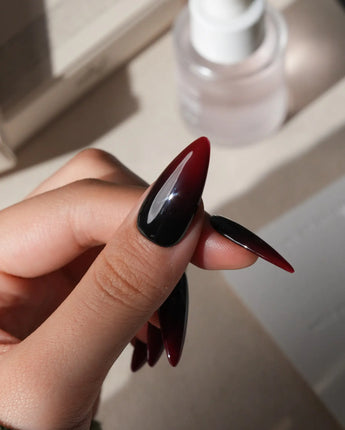 Nightcap press on nails in a near-black wine red that fades to a clearer red at the tip with a high gloss finish - image 4