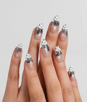 Noir Lace couture nude nails with white tips, black dots and hand-painted lace