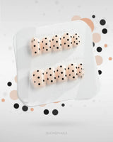 Dot Noir-Mini press-on nails with nude base, black contrast, and retro polka-dot art