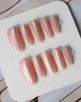 Nude Blush cat-eye press-on nails in medium almond shape — blush pink cat eye nails