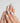 Nude Christmas press-on nails with snowflake and bow details
