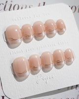 Your Glow in extra short squoval shape with nude cat-eye French tips and gold wire detail