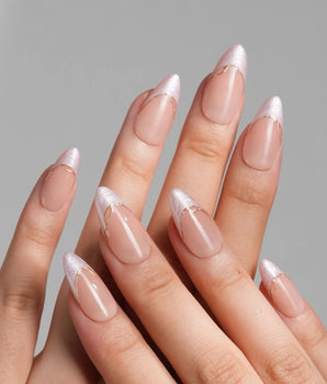 Your Glow in medium almond shape with nude cat-eye French tips and fine gold accents