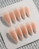 Your Glow in medium stiletto shape with nude cat-eye French design and gold linework