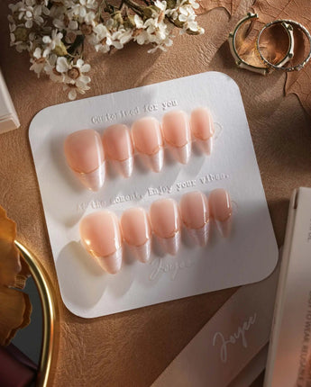 Your Glow in short stiletto shape with nude cat-eye French tips and glossy gel finish