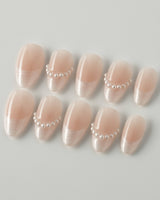Dew Sparkle in extra short almond shape with soft French tips and pearly gel finish