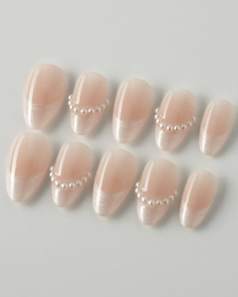 Dew Sparkle in extra short almond shape with soft French tips and pearly gel finish