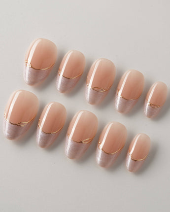Your Glow in extra short almond shape with nude cat-eye French tips and gold accents