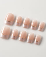 Your Glow in extra short square shape with nude cat-eye French tips and gold wire accents