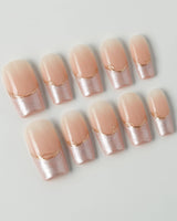 Your Glow in medium square shape with glossy nude French tips and metallic gold detail