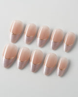 Your Glow in short almond shape with soft nude French tips and cat-eye shimmer