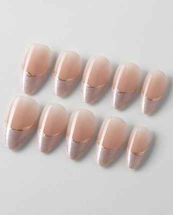 Your Glow in short almond shape with soft nude French tips and cat-eye shimmer