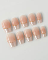 Your Glow in short coffin shape with glossy nude French tips and delicate gold line accents