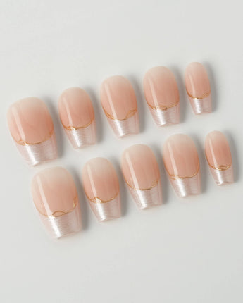 Your Glow in short coffin shape with glossy nude French tips and delicate gold line accents