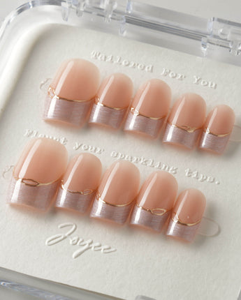 Your Glow in short square shape with nude cat-eye French tips and gold line detail