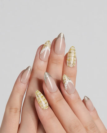 Tweed Light handmade press-on nails featuring nude base gold glitter french tips yellow plaid lace trim