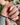 Nude pink nails with hand-painted sakura petals and pearl French line	