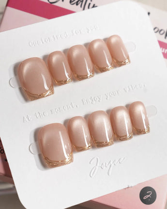 Nude Spark press-on nails in extra short square shape — Premium Champagne Cat Eye, Irregular French Metal Outlines.