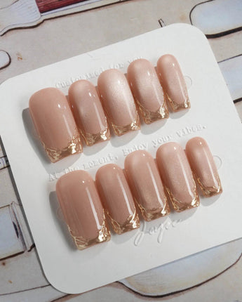 Nude Spark press-on nails in medium square shape — Premium Champagne Cat Eye, Irregular French Metal Outlines.