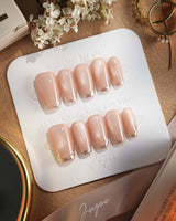 Nude Spark press-on nails in short coffin shape — Premium Champagne Cat Eye, Irregular French Metal Outlines.