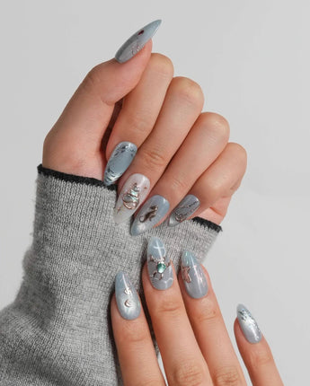 Ocean Heart hand-painted seagrass nails with conch shells and jewel-like sea details
