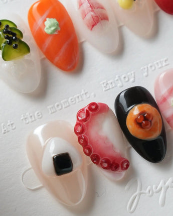 Omakase 3D sushi nail art on nude, coral, black, pink marble, and amber bases