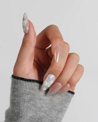 Opal Moon medium almond nail set with candlelit rose-gold chrome finish
