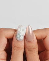 Opal Moon glossy press-on nails with irregular opalescent dots like gemstones