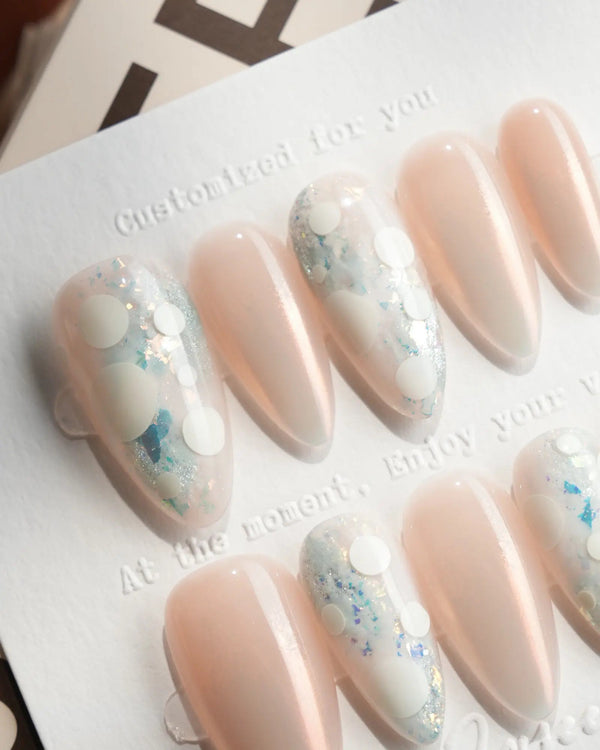 Opal Moon medium almond press-on nails with rose-gold chrome and opalescent dots