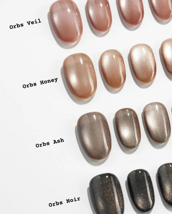 Orbs Team #1 handmade press-on nails featuring brown cat eye