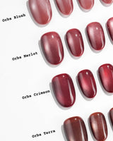 Orbs Team #2 handmade press-on nails featuring red cat eye
