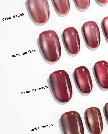 Orbs Team #2 handmade press-on nails featuring red cat eye
