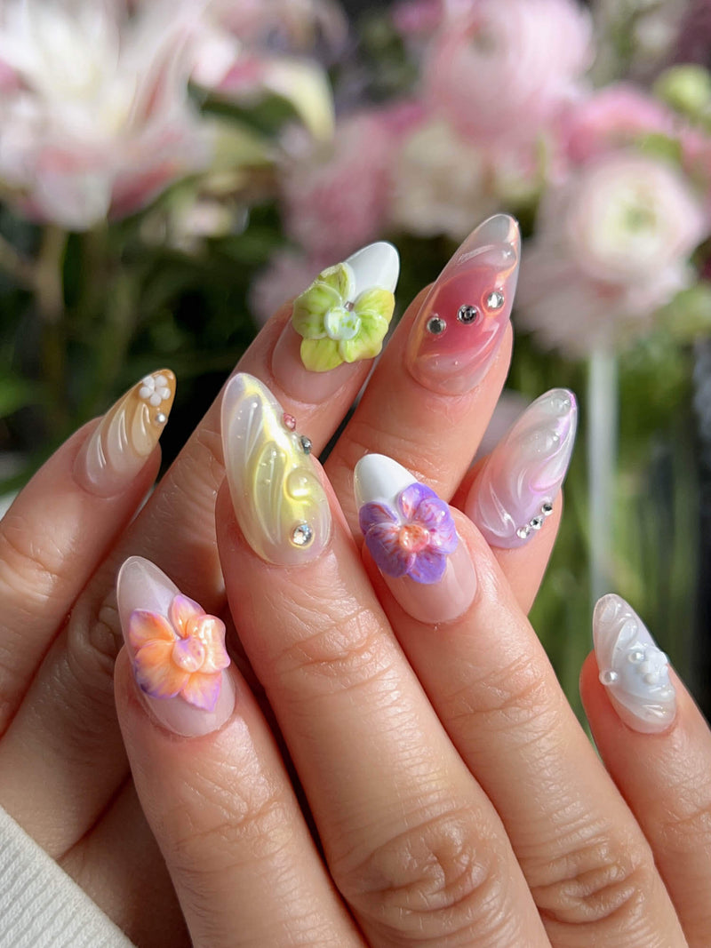 Orchid-Extra Glow handmade press-on nails featuring colorful 3D sculpted orchid flowers with shell textures and aurora shimmer