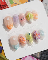 Orchid-Extra Glow press-on nails in extra short almond shape — Colorful Summer, 3D Orchids & Shell Textures.