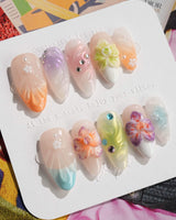 Orchid-Extra Glow press-on nails in medium almond shape — Colorful Summer, 3D Orchids & Shell Textures.