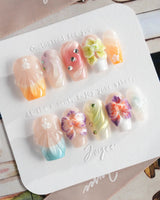 Orchid-Extra Glow press-on nails in short coffin shape — Colorful Summer, 3D Orchids & Shell Textures.