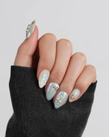 Otter Momo jelly water nails with otter figures, cherry blossom petals, and starfish