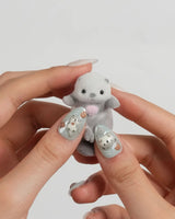 Otter Momo extra short almond nails with otter charm and translucent wave design