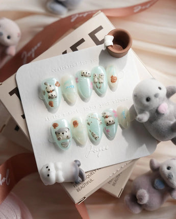 Otter Momo handmade press-on nails featuring otter nail art