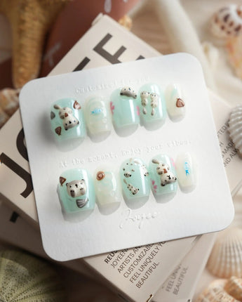 Otter Momo extra short coffin nails with 3D otter and mint cream jelly base