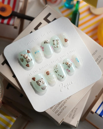 Otter Momo extra short oval nails with mint jelly waves and 3D otter accents