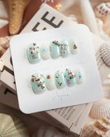 Otter Momo extra short square nails with otter charm and translucent ocean texture