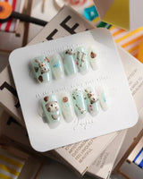 Otter Momo short coffin nails with otter details, shell accents, and tiny fish bones