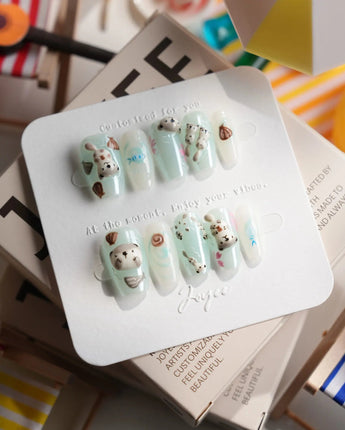 Otter Momo short coffin nails with otter details, shell accents, and tiny fish bones