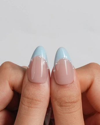 Oyster Blue glossy nude nails with clean blue French tips and coastal pearl details